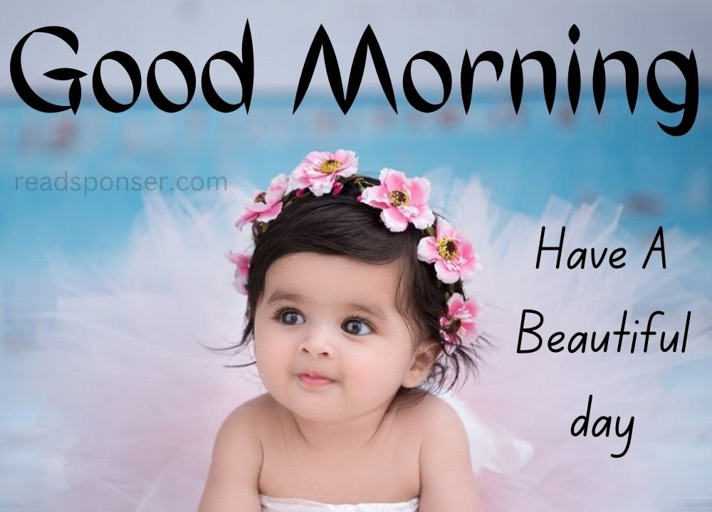 A adorable child is there with tiara on her had and wishing you a cute morning