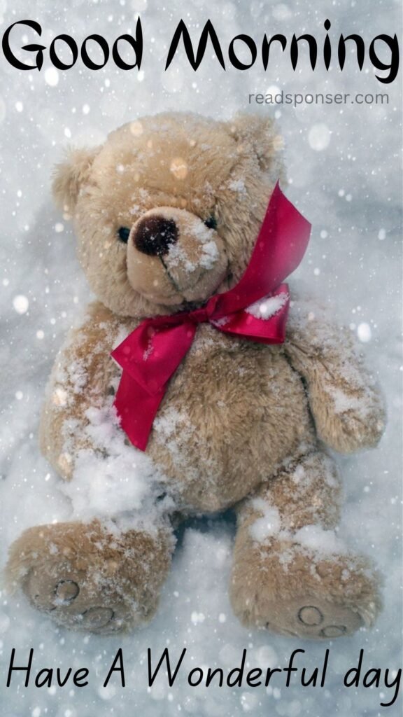 A teddy is fallen on the sheet of snow looking like he is enjoying the winter season in this morning
